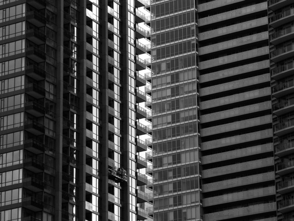 window cleaners on glass towers